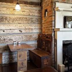Log House 1776 Restaurant - Seating and fireplace.