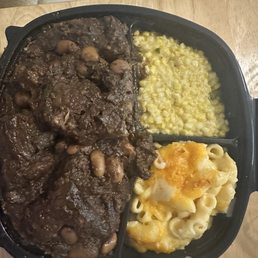 Oxtails, white rice, macaroni and cheese, and fried corn. Cornbread not pictured. Oxtails, white rice, macaroni and cheese, and fried corn. Cornbread not pictured.