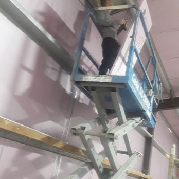 Home Run Repair - me hanging 4×8 styrofoam insulation sheets - Handyman Near Me