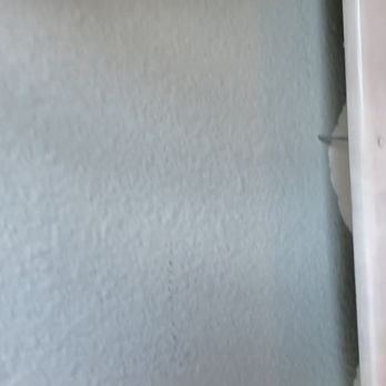 Five Star Bath Solutions - Plano - Fit and finish panel gap between shower trim and dry wall. Also, exposed nail. - General Contractors Near Me