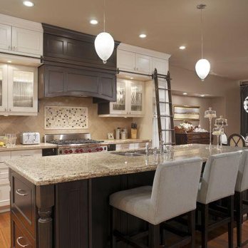 Dean Lopez Construction - a large kitchen with a center island - General Contractors Near Me