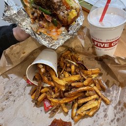 A big juicy burger, with Cajun Fries and a Strawberry Milkshake. A big juicy burger, with Cajun Fries and a Strawberry Milkshake.