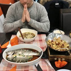 Yixinge - Steamed Fish, Pork Rib Bone Noodle Soup, Chili Cabbage and two bowls of steamed rice. You cannot go wrong!