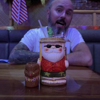 Cane Tiki Room - Husband with our drinks - Tiki Bars Near Me - Paso Robles, California Cane Tiki Room - Husband with our drinks - Tiki Bars Near Me - Paso Robles, California