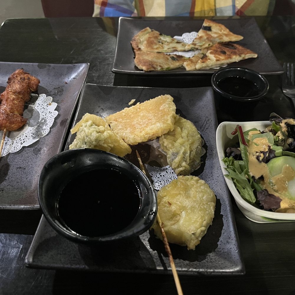 Partially nommed chicken satay, scallion pancake, salad, and veggie tempura Partially nommed chicken satay, scallion pancake, salad, and veggie tempura