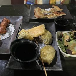 Partially nommed chicken satay, scallion pancake, salad, and veggie tempura Partially nommed chicken satay, scallion pancake, salad, and veggie tempura