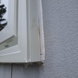 Ecoline Windows - Lots of caulking to cover gaps and some more black stuff on frame.