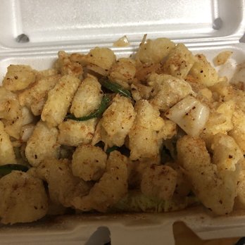 Asian Taste - Fried spicy calamari on top of sautéed onions and a bed of lettuce - Sushi Bars Near Me - Medford, Massachusetts Asian Taste - Fried spicy calamari on top of sautéed onions and a bed of lettuce - Sushi Bars Near Me - Medford, Massachusetts
