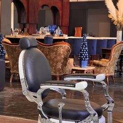 The Exchange Barbershop & Lounge Wilmington - This vintage-style barber chair is the epitome of comfort and style! It helps you escape a busy day & enjoy feeling pampered & valued