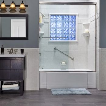 We Improve For You - Milford - a bathroom with a bathtub, toilet, and sink - Pool & Hot Tub Service Near Me - Milford, Connecticut We Improve For You - Milford - a bathroom with a bathtub, toilet, and sink - Pool & Hot Tub Service Near Me - Milford, Connecticut