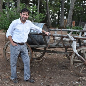 Paloma Vineyard - a man standing in front of a wagon - Wineries Near Me - St. Helena, California Paloma Vineyard - a man standing in front of a wagon - Wineries Near Me - St. Helena, California