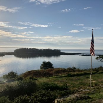 Blue Restaurant - a view of a lake and a flag - Seafood Near Me - Georgetown, Maine