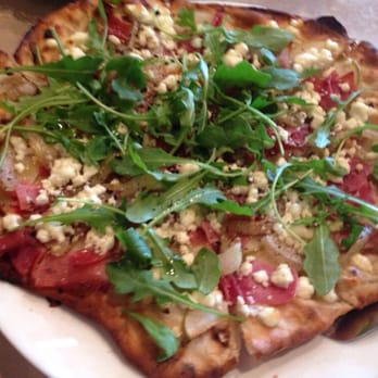 Tuscany Grill - Pear, prosciutto, goat cheese and arugula flat bread - Italian Near Me - Melbourne, Florida Tuscany Grill - Pear, prosciutto, goat cheese and arugula flat bread - Italian Near Me - Melbourne, Florida