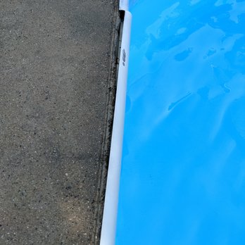 Carolina Designs Realty & Vacation Rentals - Broken rim around pool - looked bad, but more dangerous than anything. - Vacation Rentals Near Me - Duck, North Carolina