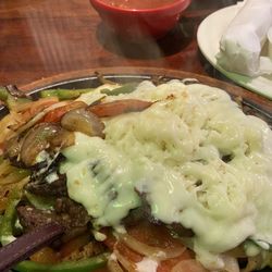 Cinco De Mayo Mexican Restaurant - Steak fajitas with the cheese all over the top