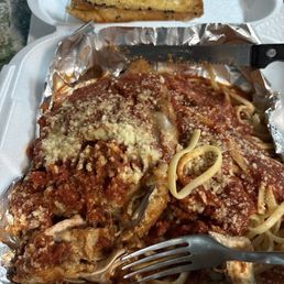 This is the Thursday nite special chicken Parmesan over pasta with garlic bread This is the Thursday nite special chicken Parmesan over pasta with garlic bread
