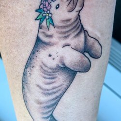 Empire Tattoo - Manatee w/ flower crown, beautiful work done by Kelsey