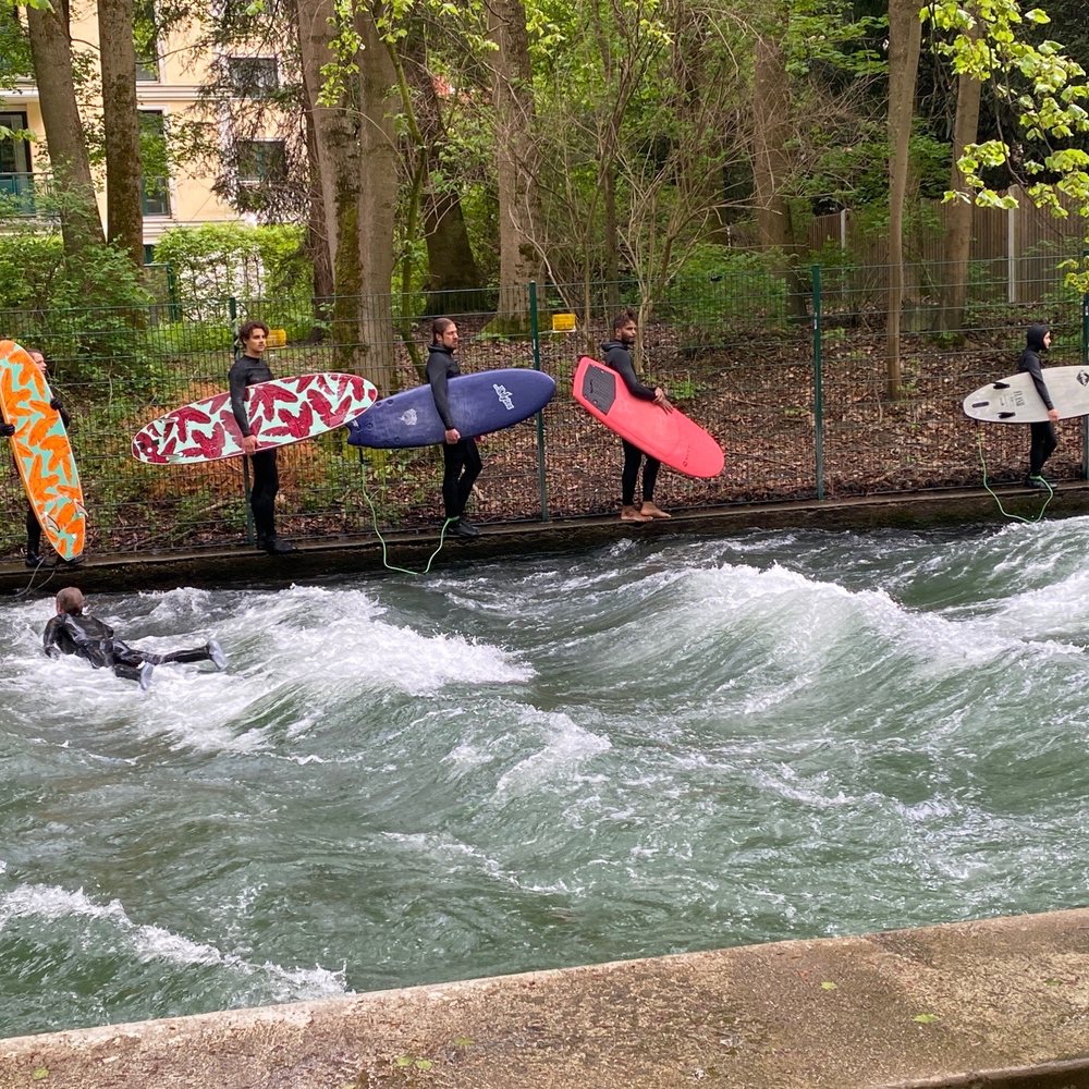 Eisbach-Welle - Lined up to surf. - Landmarks & Historical Buildings Near Me - Munich, BY Eisbach-Welle - Lined up to surf. - Landmarks & Historical Buildings Near Me - Munich, BY
