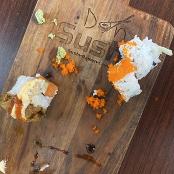 Don Sushi - a wooden cutting board with sushi on it - Sushi Bars Near Me - Albuquerque, New Mexico