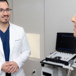 North Shore Headache and Spine - Dr. Ocasio with patient.