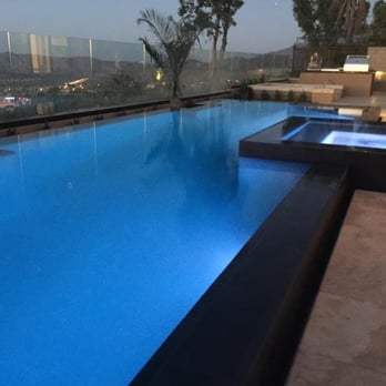 Bayrich Construction - Infinity edge pool design allows this contemporary pool to rise up above the rest. - General Contractors Near Me - Anaheim, California Bayrich Construction - Infinity edge pool design allows this contemporary pool to rise up above the rest. - General Contractors Near Me - Anaheim, California