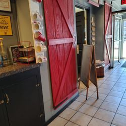 Aroma Coffee Shop - Station with toaster, microwave, sweetener... Indoor entrance to bakery next door.