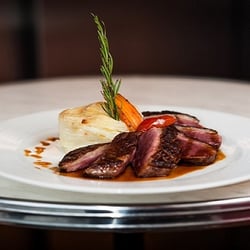 Frenchy's - Southwestern French Duck Breast with au gratin potatoes, honey and thyme sauce