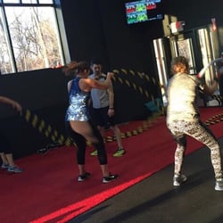 Amped Fitness - Battle ropes time! You can see the heart rates on the screen above us.