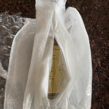 The UPS Store - More layers and more tape to finally get to the bottle. - Printing Services Near Me - Laguna Beach, California