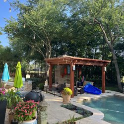 Your Sawlution Tree Service - Broken and dead branches removed from over pergola and pool, canopy raised.