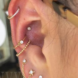 Rebel Rebel Body Piercing - Healed conchs and lives with new gold jewelry
