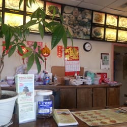 Ordering counter area. The 'dining' area consisted of one large table, four chairs and various children's toys/bikes?