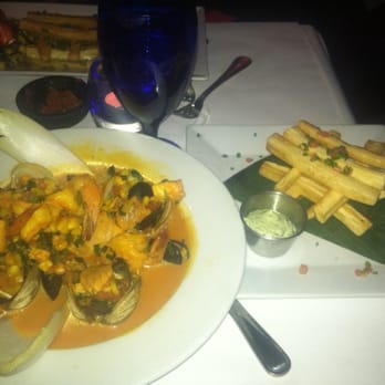 Ola Latin Kitchen - Tapado de Mariscos with a side of order of Yucca Fries - Latin American Near Me - Bridgeport, Connecticut Ola Latin Kitchen - Tapado de Mariscos with a side of order of Yucca Fries - Latin American Near Me - Bridgeport, Connecticut