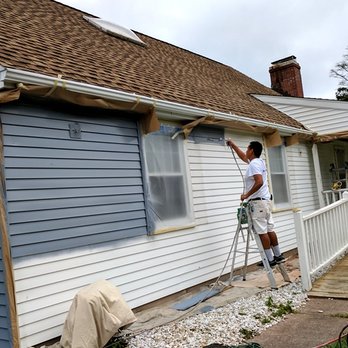 Rich Bakey’s Landscaping - a man painting a house - Landscaping Near Me Rich Bakey’s Landscaping - a man painting a house - Landscaping Near Me