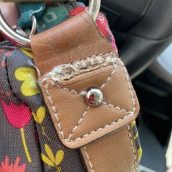 Down Town Cleaners - "Fixed" edge of purse. This was NOT how it originally looked. It's so butchered that I'm not even sure an expert repair person did this job.