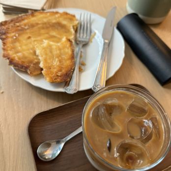 SAIN Boulangerie - La Tournade with an iced latté. - Bakeries Near Me - Paris, 75 SAIN Boulangerie - La Tournade with an iced latté. - Bakeries Near Me - Paris, 75
