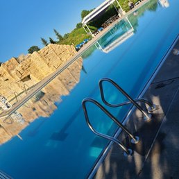 Main pool area w/zip line and climbing wall to left. Taken while waiting for water aerobics to start, normally not this calm and quiet.