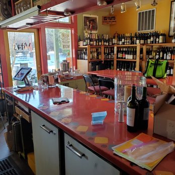 Vita's Wildly Delicious - a red counter top with bottles of wine on it - Cafes Near Me - Lopez Island, Washington Vita's Wildly Delicious - a red counter top with bottles of wine on it - Cafes Near Me - Lopez Island, Washington