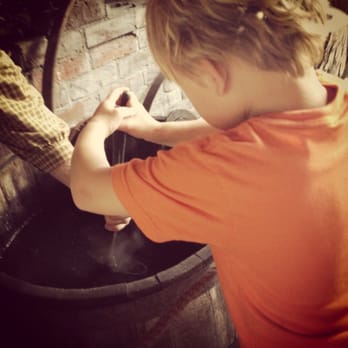 Mahaffie Stagecoach Stop & Farm - Cooling of iron hook in the blacksmith shop - Museums Near Me - Olathe, Kansas Mahaffie Stagecoach Stop & Farm - Cooling of iron hook in the blacksmith shop - Museums Near Me - Olathe, Kansas