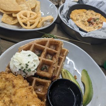 Chicken N Pickle - Chicken and bacon waffle and in the back, chorizo queso. Yummy! - Pickleball Near Me - Glendale, Arizona Chicken N Pickle - Chicken and bacon waffle and in the back, chorizo queso. Yummy! - Pickleball Near Me - Glendale, Arizona