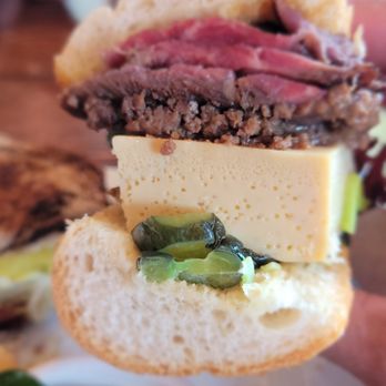 Lardon - a person holding a sandwich in their hand - Cafes Near Me - Chicago, Illinois Lardon - a person holding a sandwich in their hand - Cafes Near Me - Chicago, Illinois