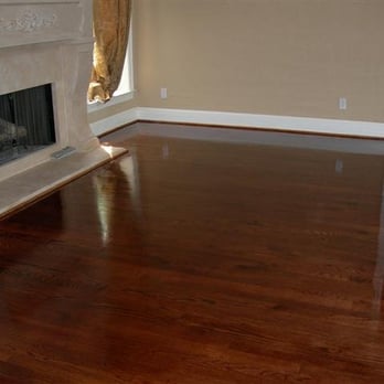 Sunshine Hardwood Floors - a fireplace in a living room - Flooring Near Me Sunshine Hardwood Floors - a fireplace in a living room - Flooring Near Me