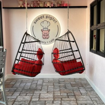 Sweet Piglet Bakery Cafe - Swinging chairs to enjoy the view outside while enjoying your bakery items and coffee - Bakeries Near Me - Randolph, Massachusetts Sweet Piglet Bakery Cafe - Swinging chairs to enjoy the view outside while enjoying your bakery items and coffee - Bakeries Near Me - Randolph, Massachusetts