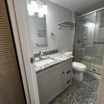 Integrity Plumbing and more - a bathroom with a shower, sink, and toilet - Plumbing Near Me - Port Orange, Florida Integrity Plumbing and more - a bathroom with a shower, sink, and toilet - Plumbing Near Me - Port Orange, Florida
