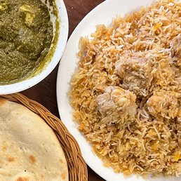 Chicken biryani, saag paneer, and naan