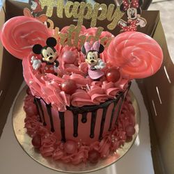 Melanated Sweets - A vanilla cake with buttercream frosting and chocolate ganache