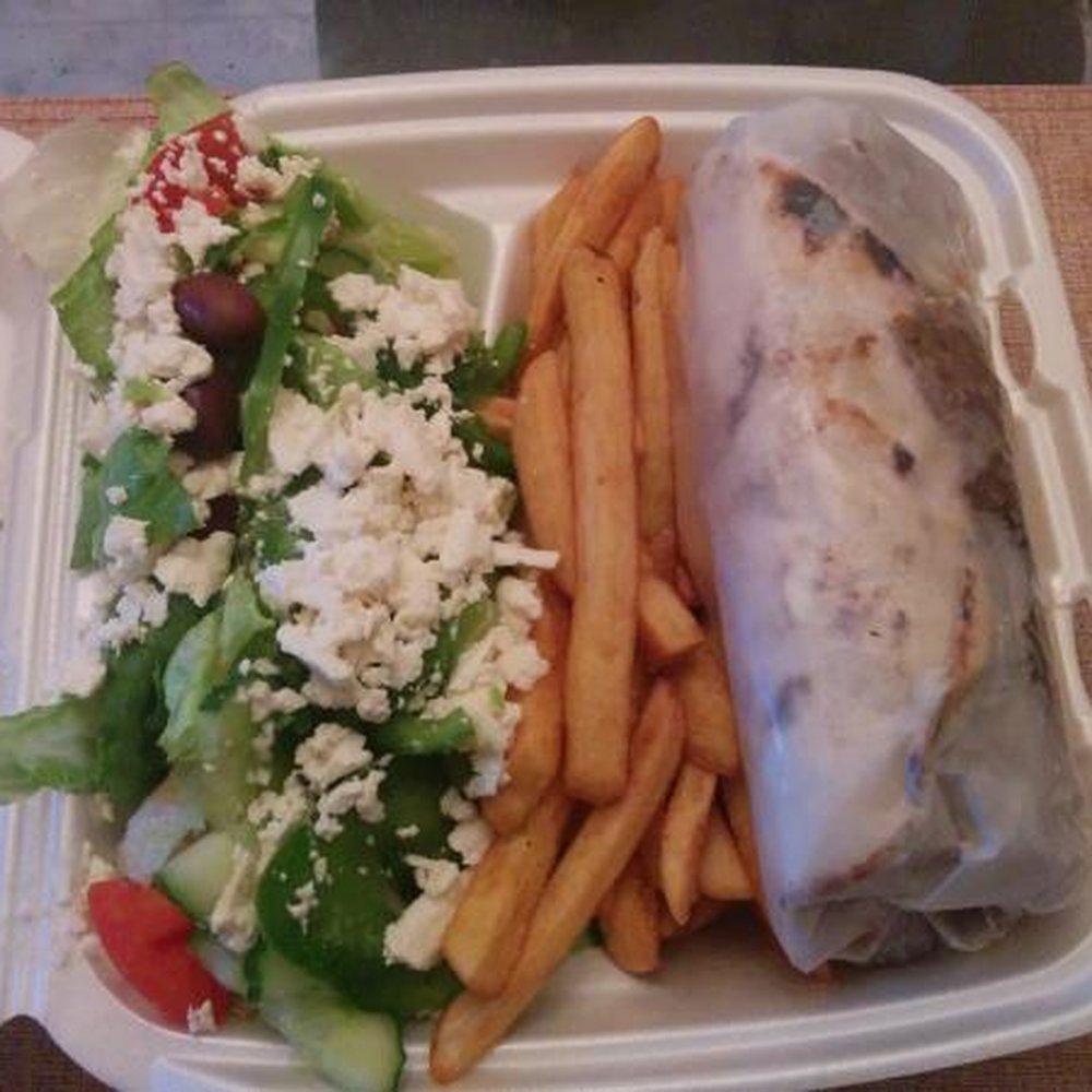 Gyro with fries and greek salad. Photo is deceiving as that's a large takeout container, gyro is very large! Gyro with fries and greek salad. Photo is deceiving as that's a large takeout container, gyro is very large!