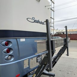 This hydraulic motorcycle lift required a great deal of fabrication work to install. It's a gorgeous engineering feat.