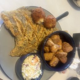 Cornmeal dusted flounder with battered Potatoes and slaw Cornmeal dusted flounder with battered Potatoes and slaw