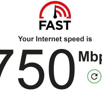 Starlight Tech - Internet speed after the Ubiquiti access points were installed - A graphic shows internet speed test results with a large '750 Mbps' reading, indicating fast internet service. - Telecommunications Near Me - Laguna Niguel, California